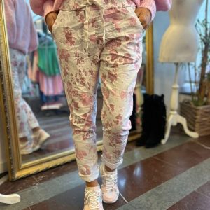 Stretchiga byxor med blommor och knyt – Rosa